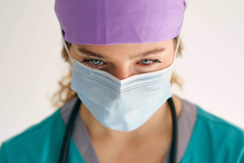 sad-woman-in-scrubs-and-mask-2022-08-02-12-48-43-utc-1024x683.jpeg